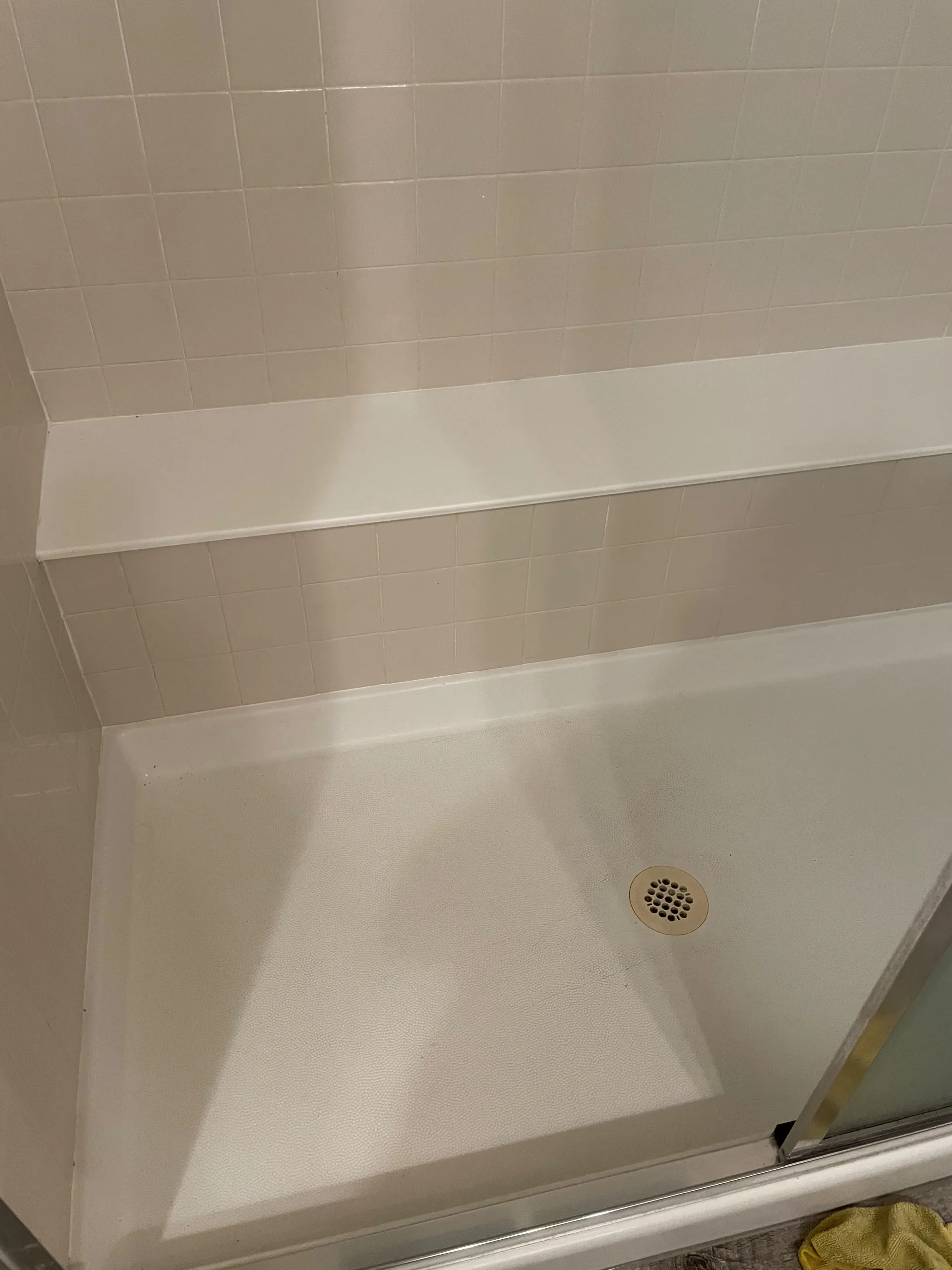 Spotless tiled shower with clean grout lines