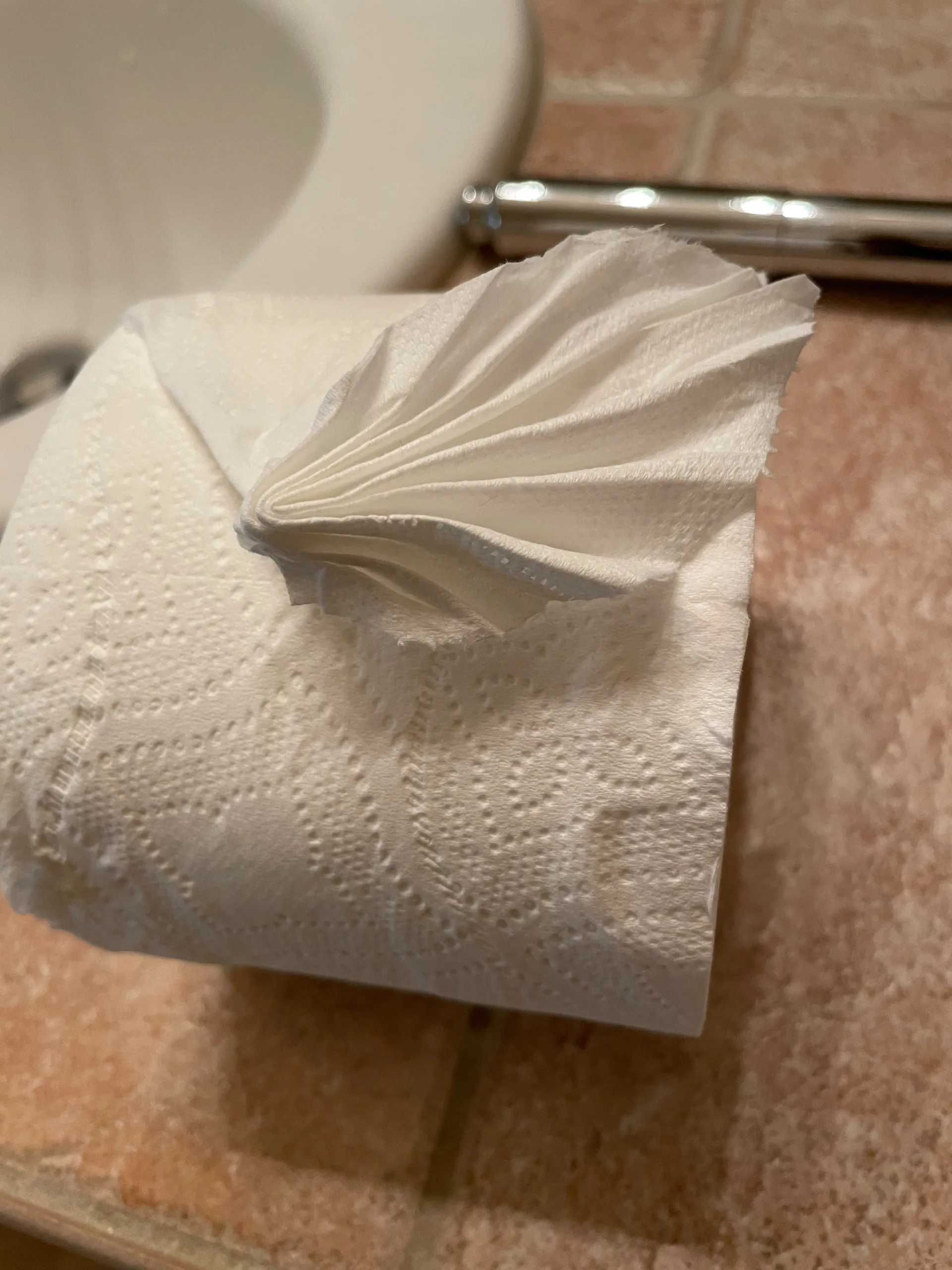 Neatly folded hotel-style towel, a hospitality touch for guest turnovers